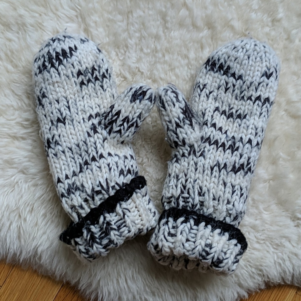 Black and white fleece lined knit mitts with